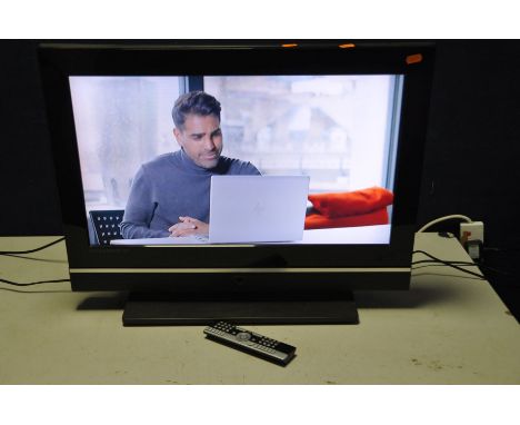 A LOGIX 26in LCD TV with a universal remote (PAT pass and working), a Samsung subwoofer and centre speaker (from a home theat