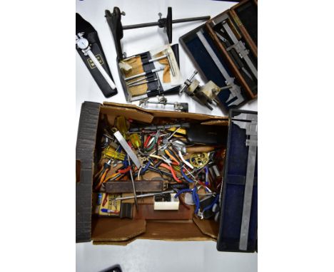 A BOX OF WATCHMAKERS TOOLS, to include a retort stand with a horizontal clamp, a boxed 'Bergeon' pair of hand levers product 