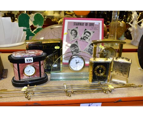 A GROUP OF SIX QUARTZ MANTLE CLOCKS, four modern clock pendulums, a framed and glazed 'STAIRWAY OF LOVE' program, the clocks 