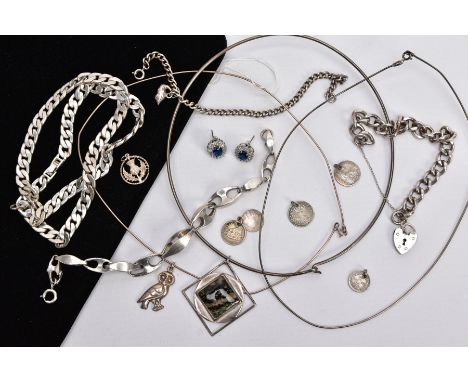 A SELECTION OF SILVER AND WHITE METAL ITEMS, to include a silver charm bracelet, fitted with a heart clasp, hallmarked London