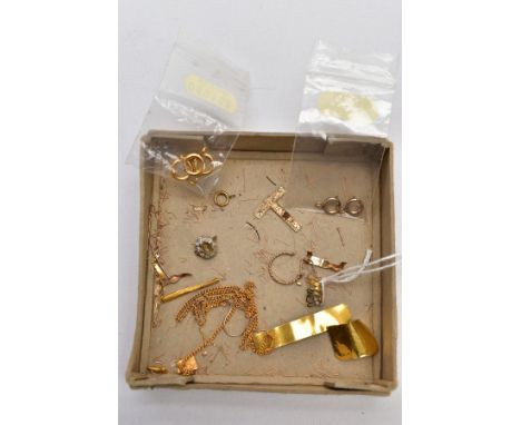 A BOX OF YELLOW METAL PIECES, to include a textured tapered pendant, stamped 375, an a/f yellow metal cross pendant, a single