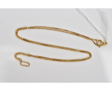 A YELLOW METAL BOX LINK CHAIN, fitted with a spring clasp, stamped '750', length 540mm, approximate gross weight 3.8 grams
