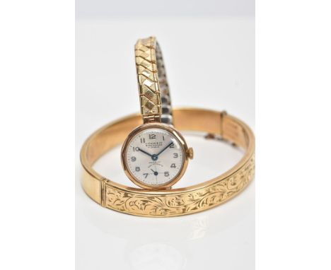 A HINGED BANGLE AND A WRISTWATCH, the hinged bangle with engraved scrolling acanthus leaf decoration, with safety chain, stam