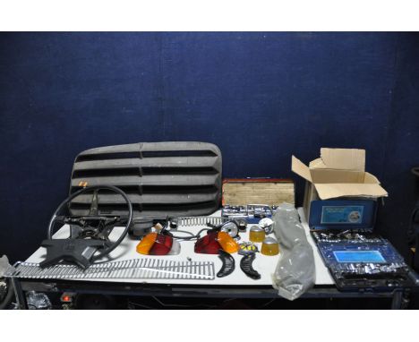 A COLLECTION OF VINTAGE CAR PARTS AND TOOLS, possibly from a Volkswagen Beetle along with partial socket sets