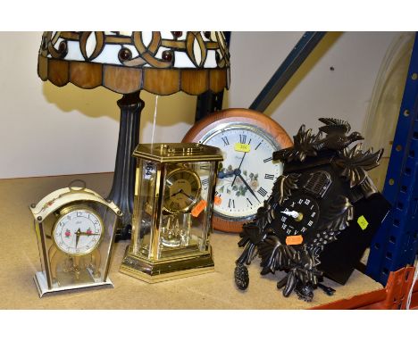 A LATE 20TH CENTURY TIFFANY STYLE LEADED GLASS TABLE LAMP AND FOUR CLOCKS, height of lamp 45.5cm, the clocks comprising a Sch