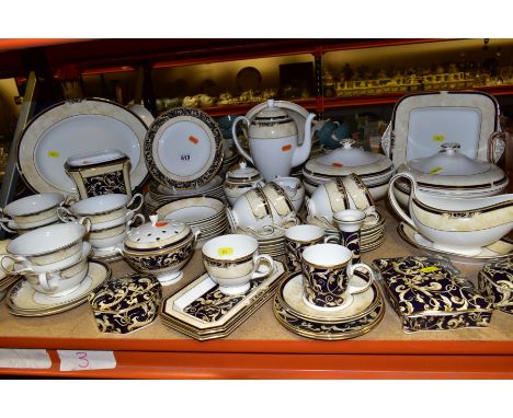 A WEDGWOOD CORNUCOPIA PART DINNER SERVICE, comprising five teacups (one rings dull), seven saucers, two coffee cans with sauc