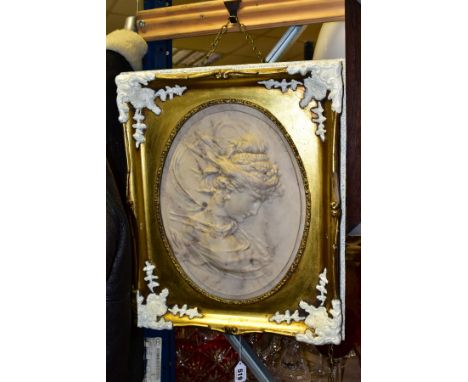 AFTER LOUIS BOTTEE (1852-1940), a marble plaque of high relief form and oval in shape depicting a head and shoulders portrait