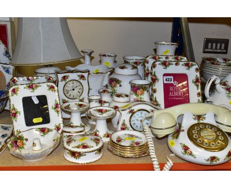 A COLLECTION OF ROYAL ALBERT OLD COUNTRY ROSES, includes an Astral telephone, two quartz movement mantel clocks, four coaster