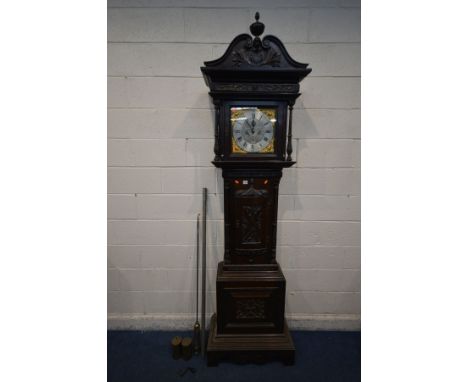 AN EARLY 20TH CENTURY OAK EIGHT DAY CHIMING LONGCASE CLOCK, the hood with an elaborate swan neck pediment flanking a finial, 