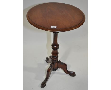 A Victorian circular mahogany occasional table on tripod base, 18" across.