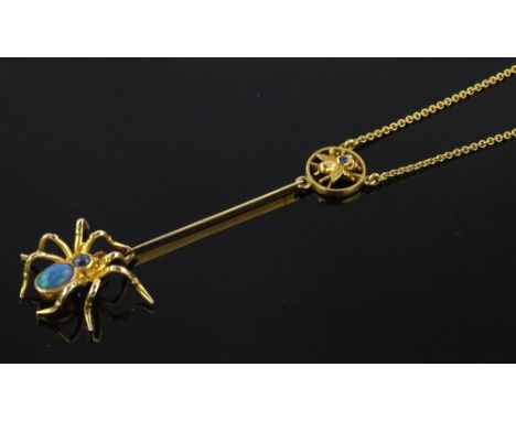 An Edwardian 9ct gold opal and sapphire set spider and fly design drop pendant and chain, pendant length 60mm, opal length 6m