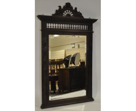 A 19th century French carved oak wall mirror, with carved figural pediment and bobbin frieze, overall height 4'7".