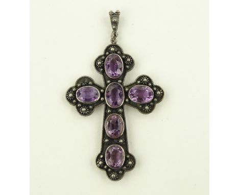An unmarked silver amethyst set cross pendant, length excluding bale 55mm.
