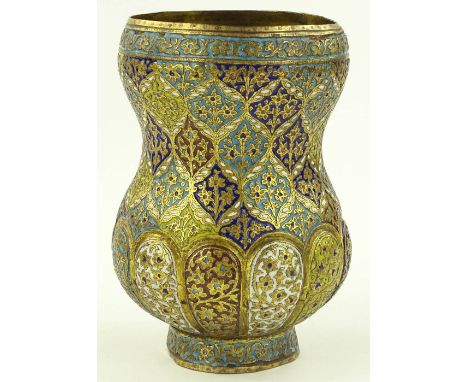 A Middle Eastern gilt brass and coloured enamel vase circa 1900, engraved geometric floral decorated panels, height 17cm.