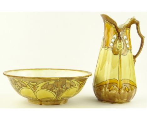 A Minton Secessionist pottery wash jug and basin set, tube-lined stylised Art Nouveau designs, bowl diameter 39cm, jug height