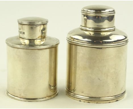 An Edwardian circular silver tea caddy, London 1905, height 9cm and a smaller silver tea caddy, Sheffield 1903, height 8cm, (