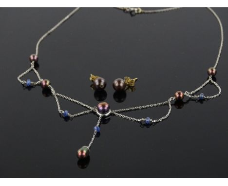 A 9ct white gold black pearl mounted necklace and a pair of matching earrings.