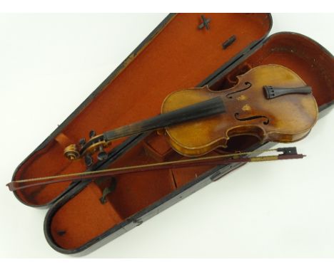 An early 20th century violin, bearing Stradivarius label, back length 33cm, wooden case.