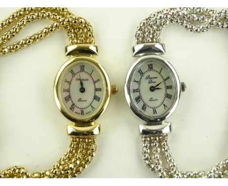A pair of silver cased lady's wristwatches, with mother of pearl dials, (2).