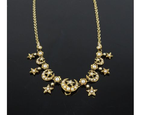 An Edwardian unmarked gold seed pearl set crescent and star design necklace.