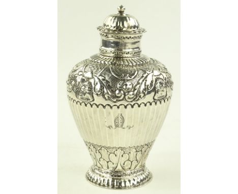 An 18th century Dutch silver tea caddy, relief decorated body with armorial crests and Amsterdam hallmarks, height 13cm.