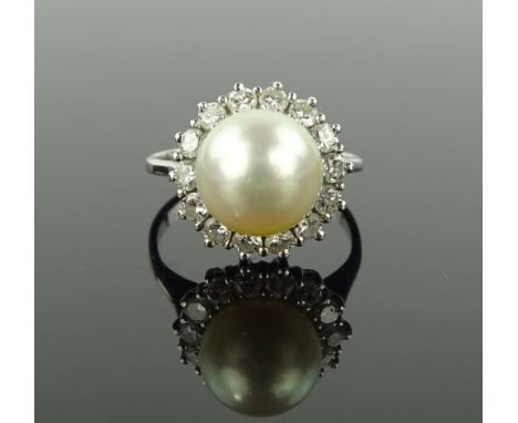 A whole pearl and diamond cluster ring in white gold setting, 13mm across, size J.