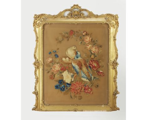 A 19th Century needlework picture, the panel depicting nesting love birds surrounded by flowers, within giltwood and gesso ac