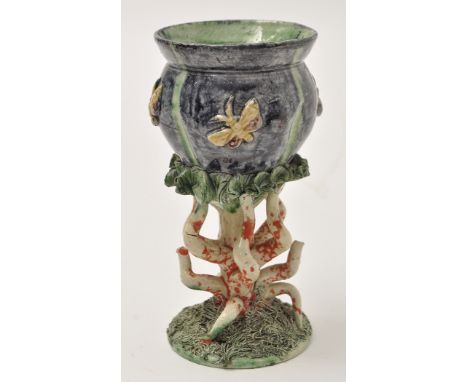 Small Palissy ware urn, in the form of small jardiniere on pedestal the sides with insects in relief above central trunk encl