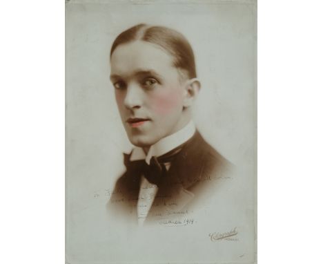 An early colourgraph portrait of Stan Laurel, inscribed, signed and dated by Stan "To Fatty Arbuckle from Geo. M. Cohan, Good