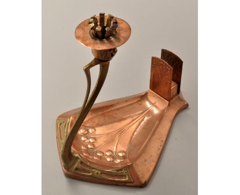 WMF: a copper and brass candlestick, the sconce with push action, on whiplash support and shield-shaped base, decorated with 