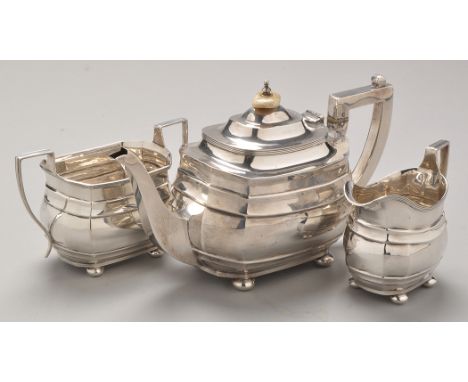 A George V three-piece silver tea service, by S. Blankenzee & Sons, Birmingham 1917, George III style shaped rectangular engr