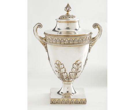 An Edwardian silver two-handled cup and cover, by Skinner & Co., London 1905, urn-shaped, with embossed leaf frieze and acant