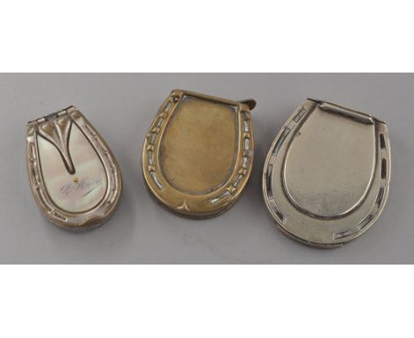 A late Victorian novelty plated vesta case, of large horseshoe form, by Howard James, 5cms (2in.); a Victorian brass vesta ca