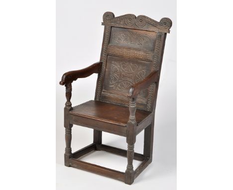 A late 17th/early 18th Century and later joint oak Yorkshire chair, the scrolling cresting rail inscribed "GL" above double p