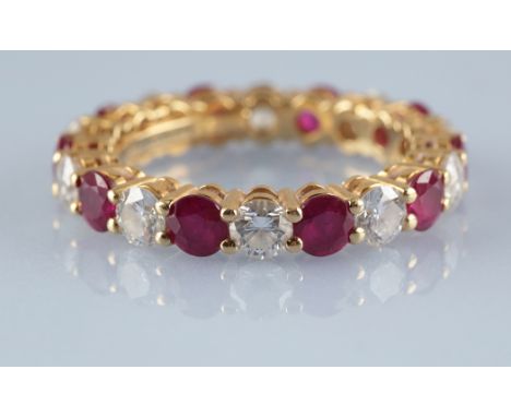 Tiffany & Co: a ruby and diamond Embrace band/eternity ring, set with ten circular facet cut rubies, each measuring approxima
