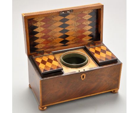 An early 19th Century mahogany tea caddy, decorated with satinwood edging, opening to reveal interior lid and lift-out canist