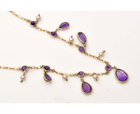 An amethyst and seed pearl fringe necklace, set with five graduated pear-cut amethyst hanging from circular facet amethysts i