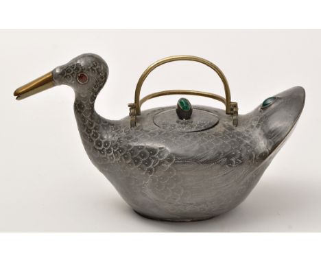 Lead bird form teapot and cover of Islamic interest, modelled in the form of a dipper swimming, 'jewelled', length 24cm.  (2)