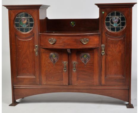 Shapland & Petter, Barnstaple: a late Victorian Arts & Crafts walnut sideboard, the bowfront centre with heart-shaped enamel 