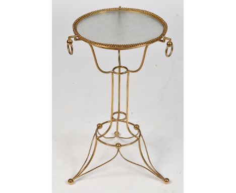 A Victorian brass basin stand, with beadwork edge and later glass insert surrounded by three ring drops, raised on tubular tr
