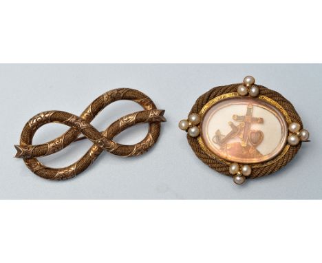 Two Victorian mourning brooches, one of yellow metal and plaited hair eternity knot pattern, engraved with foliate scrolls, 5
