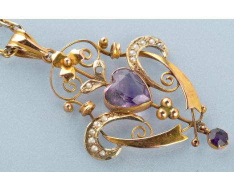 An Edwardian Art Nouveau amethyst and seed pearl pendant, the central heart-shaped cut amethyst surrounded by seed pearl set 