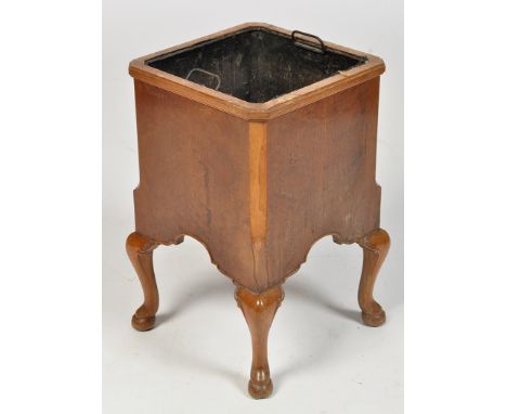 An early 20th Century burr walnut planter, of canted square form with inset galvanised liner, raised on cabriole legs and hoo
