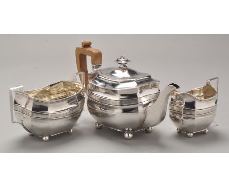 A George III three-piece tea service, by Solomon Hougham, London 1807 and 1808, each piece of shaped oval form, engraved init