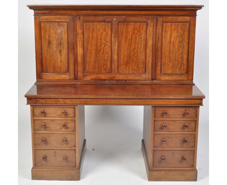 A Victorian pedestal desk, by Sopwith & Co. Newcastle on Tyne, the top section with a central fall-flap opening to reveal and