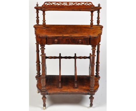 A Victorian burr walnut side table, the upper shelf with pierced scrolling back raised on turned supports, the shaped top fit