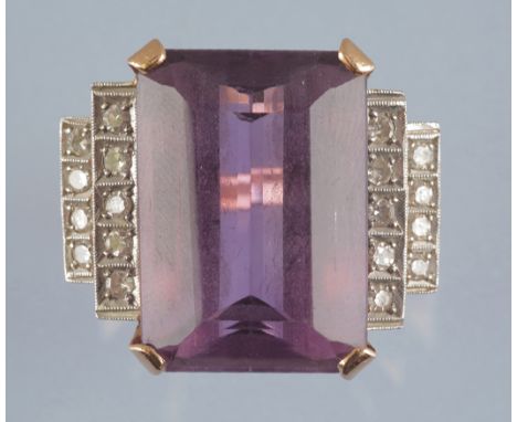 An Art Deco style amethyst and diamond dress ring, the rectangular step-cut amethyst measuring 22 x 15.4 x 11mm, estimated to