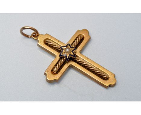 A Victorian yellow metal crucifix pendant, centred by a star with seed pearl and blue enamel design, rope twist cross surroun