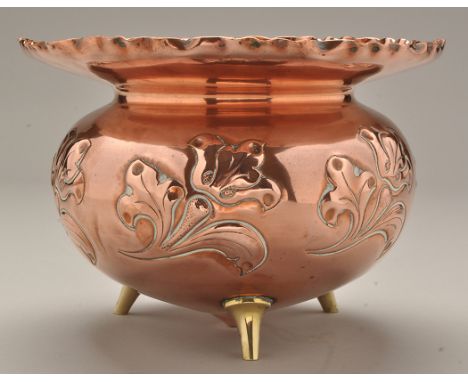 Sir Christopher Dresser for Benham & Froud: and embossed copper planter, the crimped circular flared rim above stylised flora
