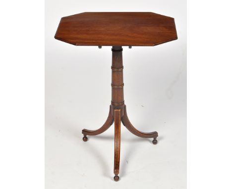 A George III mahogany occasional table, the octagonal top on turned 'gun barrel' support and three splay legs terminating in 